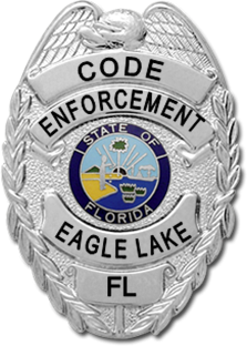 Silver Badge that reads Code Enforcement Eagle Lake FL in black letters, and has a state of florida seal in the center.