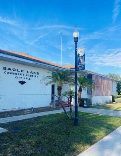city_hall_new.jpg Eagle Lake City Hall, a white building with a flag pole